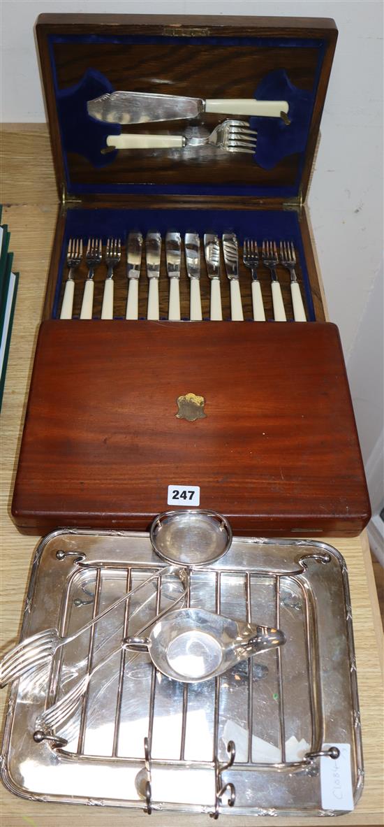 Two cased sets/part sets of cutlery and a plated asparagus dish.